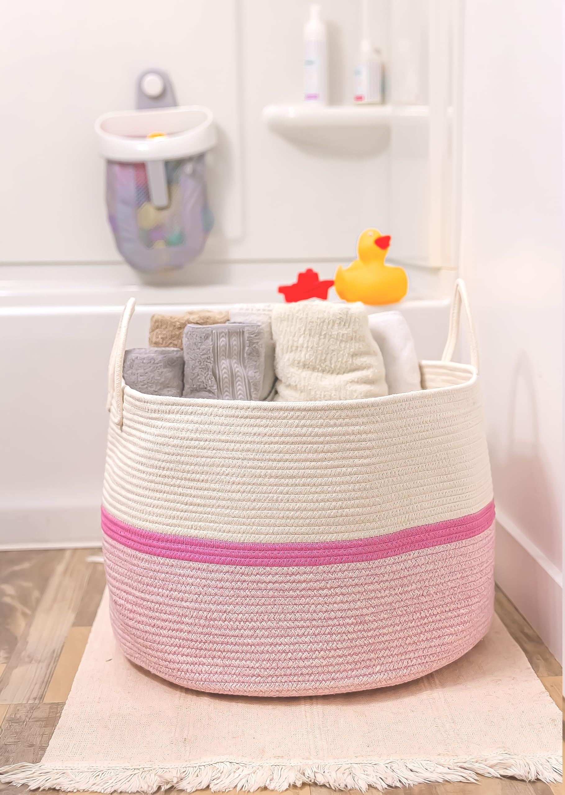 OrganiHaus pink stripe basket adds nursery storage with soft color.