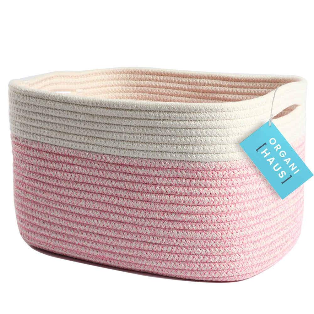 OrganiHaus woven storage basket in pink keeps shelves tidy and adds soft decorative charm.