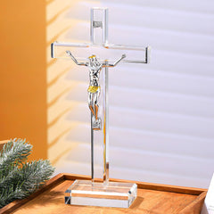 Ornalrist standing crystal cross 10in reflecting rainbow light on a shelf