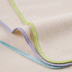 Close-up of OsoCozy flannel texture highlights softness and fabric quality.