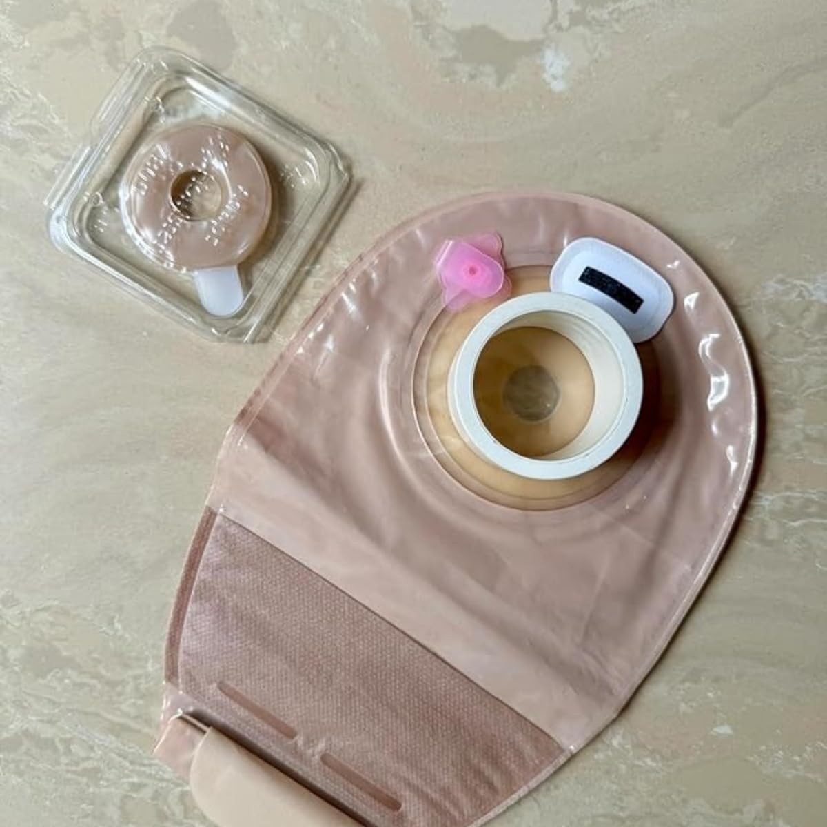 OSTOCARE pink ostomy vent travel-friendly solution for discreet pressure relief.