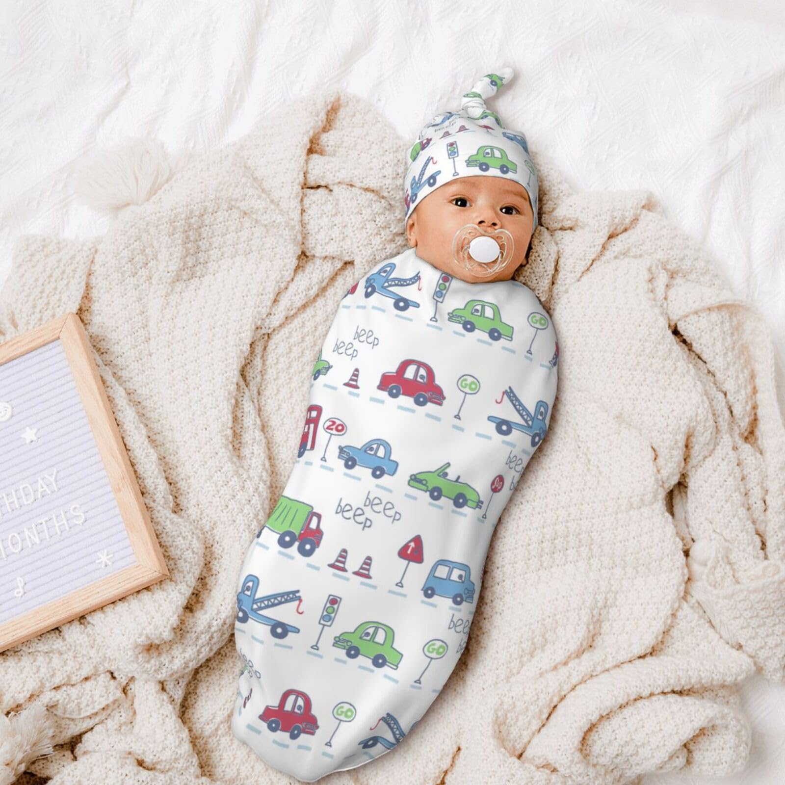 Osvbs car theme swaddle hat from the set adds warmth with style.