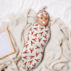 OSVBS Crawfish swaddle set with matching hat provides complete newborn outfit and warmth