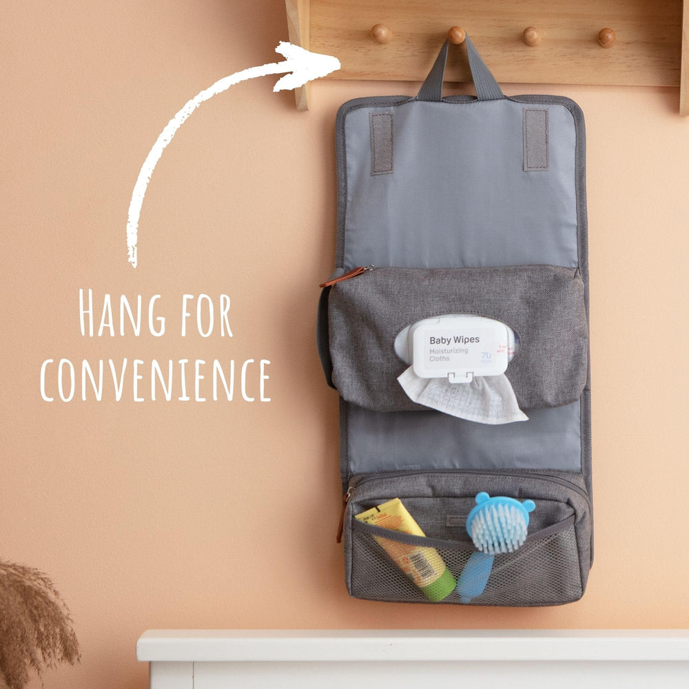 Outbound Basics diaper pouch hanging from restroom hook for convenient diaper changes