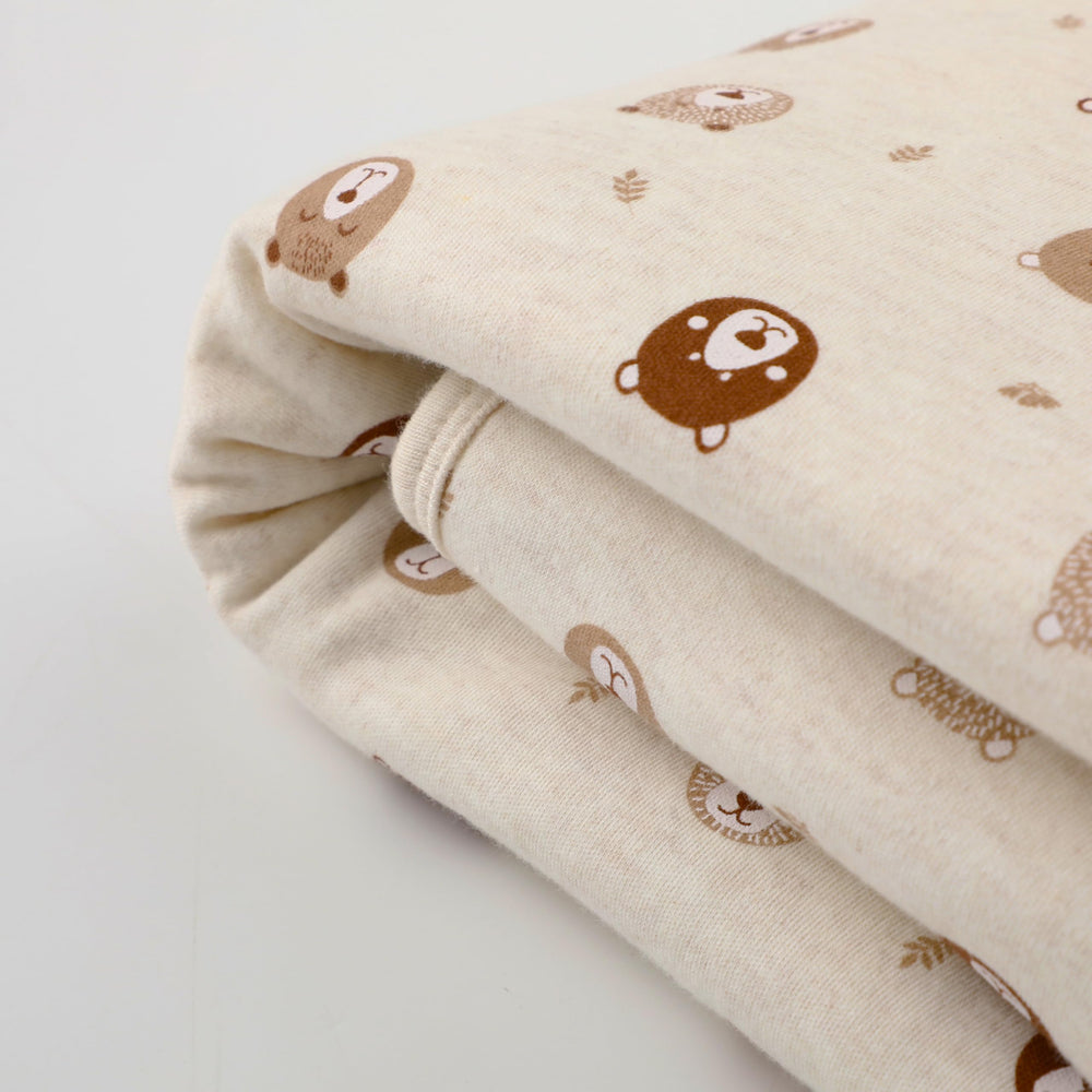 Owlivia reversible neutral blanket graphic print side adds playful nursery style.