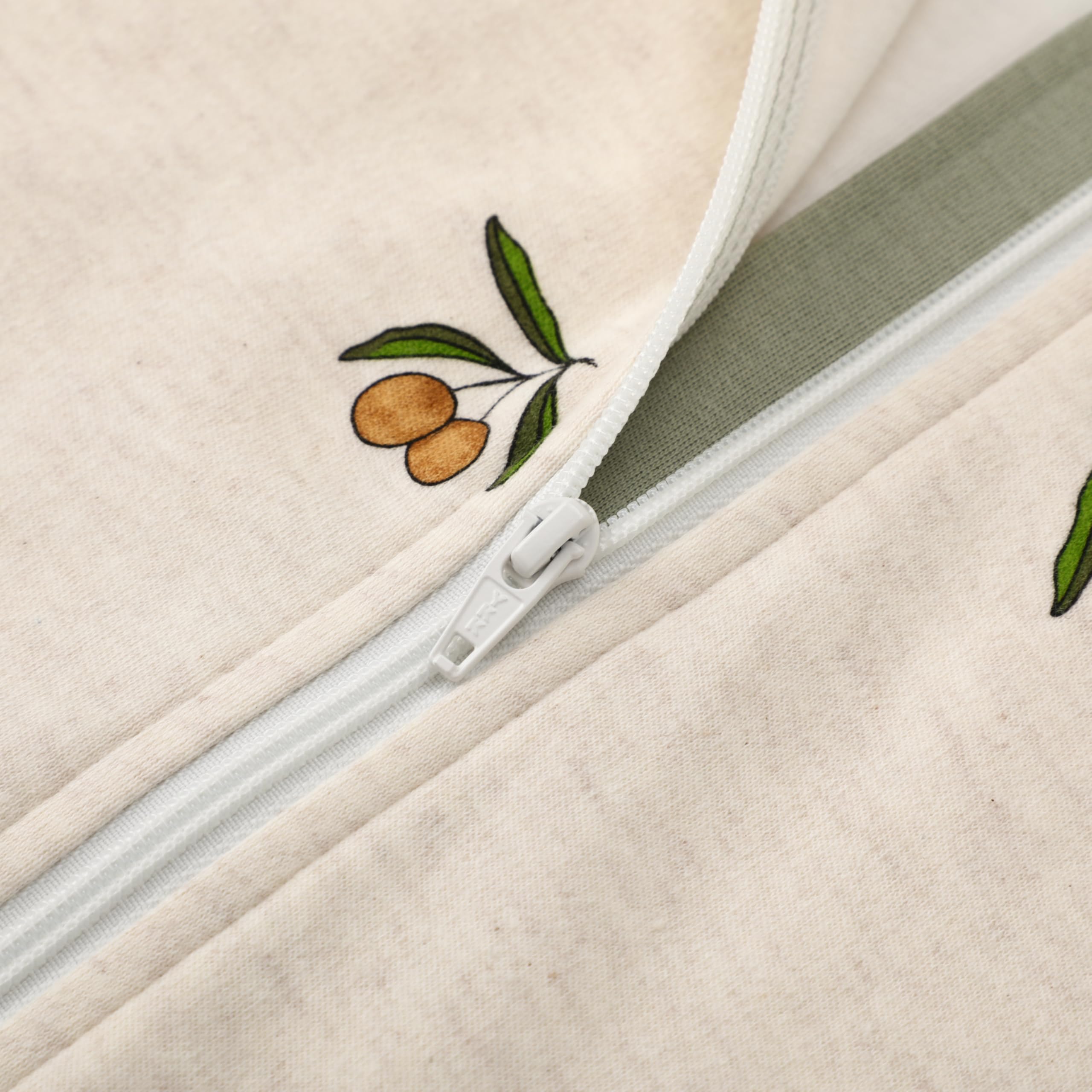 Owlivia two-way zipper with top and bottom protectors simplifies diaper changes.