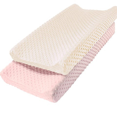 Owlowla changing pad cover with pink-cream minky dots offers a soft, cozy surface.