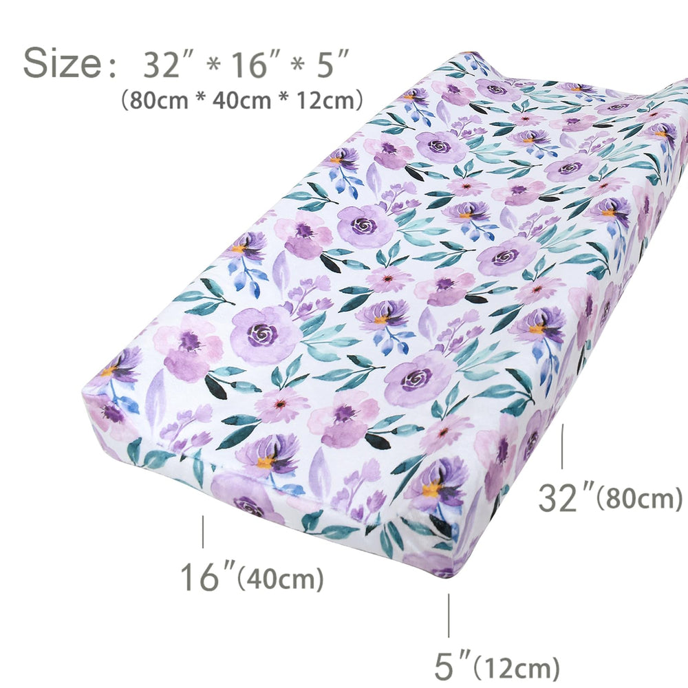 Owlowla machine-washable changing pad cover for quick cleanup.