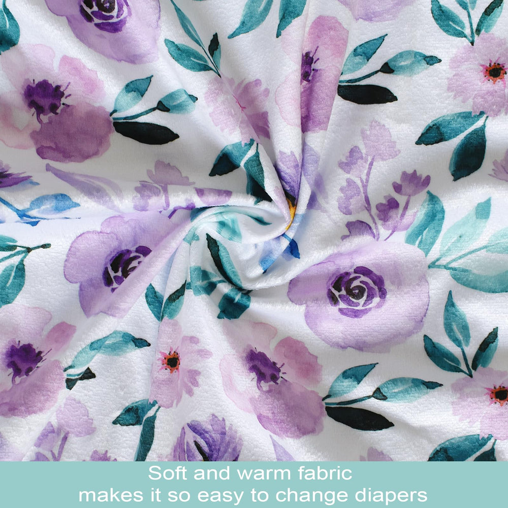 Owlowla waterproof changing pad cover with elastic bottom for secure fit on standard pads.