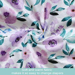 Owlowla waterproof changing pad cover with elastic bottom for secure fit on standard pads.