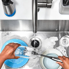 OXO Steel Bottle Brush shown as dishwasher-safe for quick, convenient cleanup.