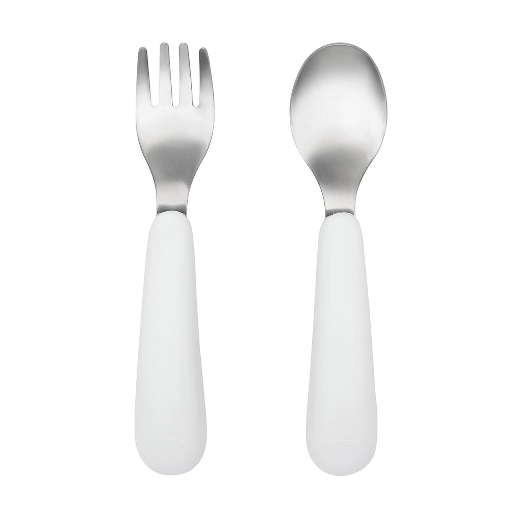 OXO Tot Training Fork & Spoon Set pink in hand demonstrating easy self-feeding