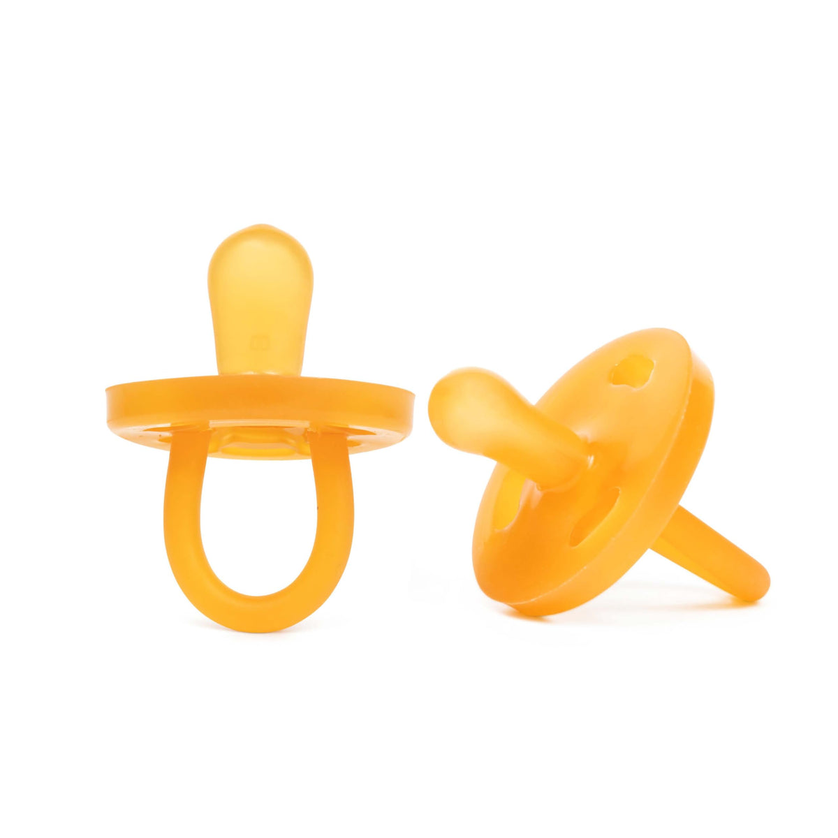 PaciBamber amber oil pacifier close-up for gentle gum soothing with natural rubber.