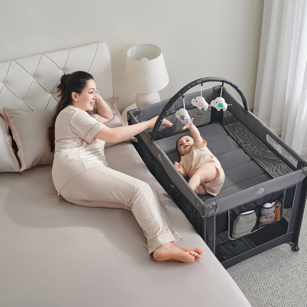 Pamo Babe compact travel cot fits in car trunk for trips.