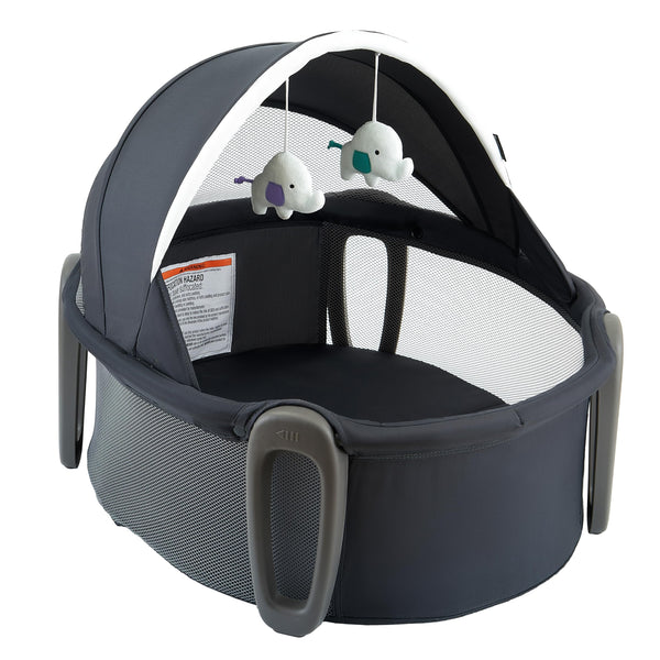 Pamo Babe Portable Bassinet Dome creating a cozy sleep space on the go.