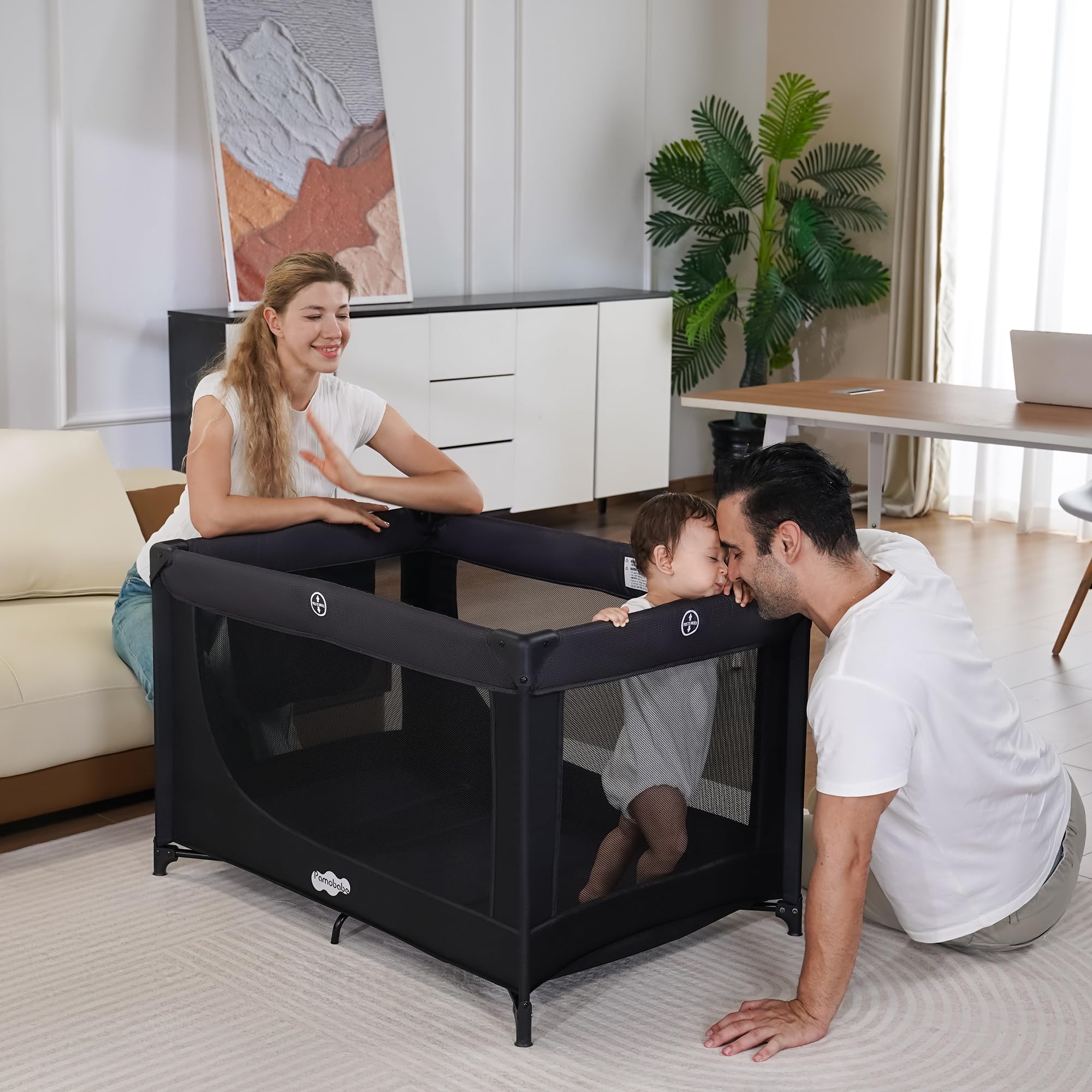 Pamo Babe soft mattress offers cushioned support inside the playpen.