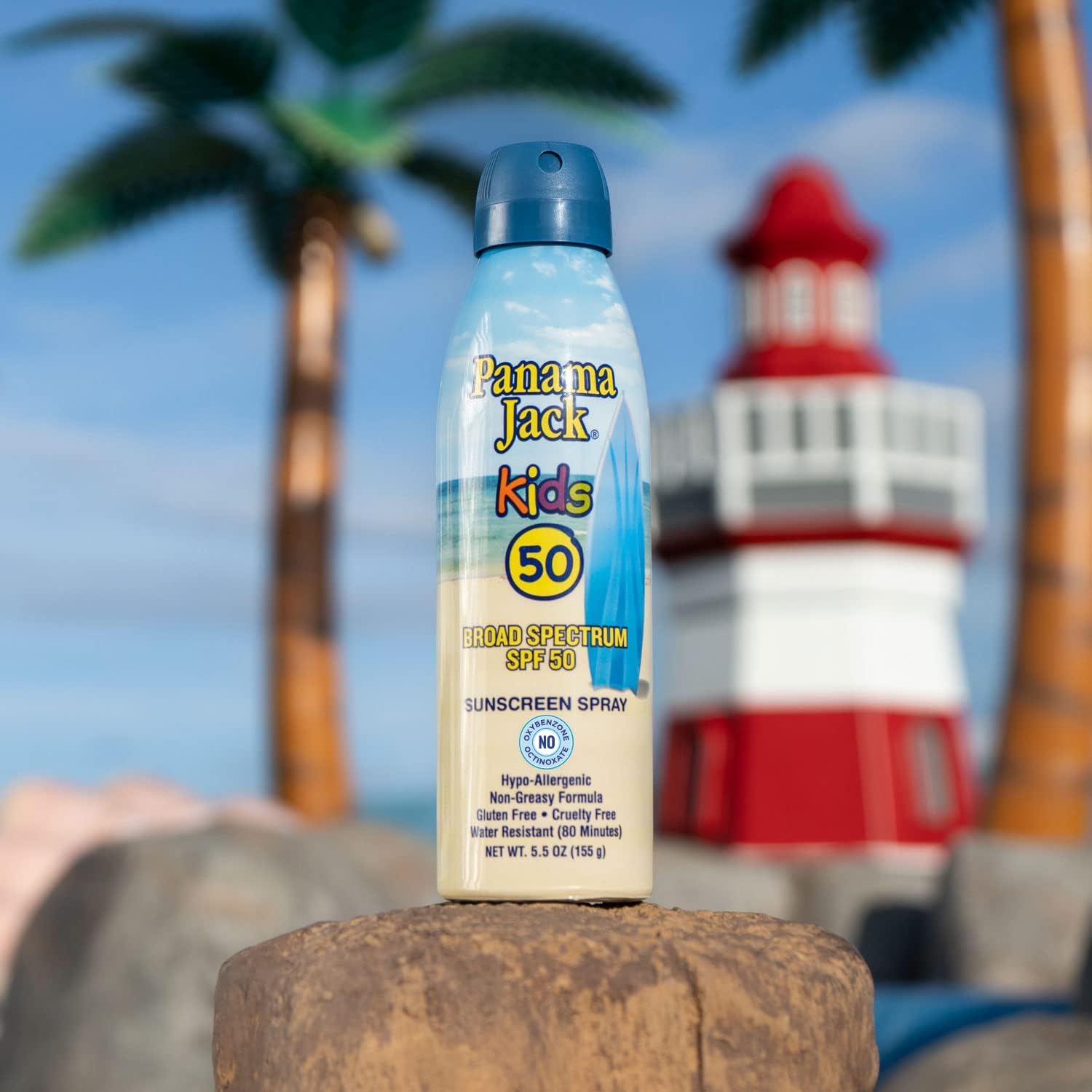 Panama Jack continuous spray kids sunscreen application shows fast-drying, clear coverage on skin.