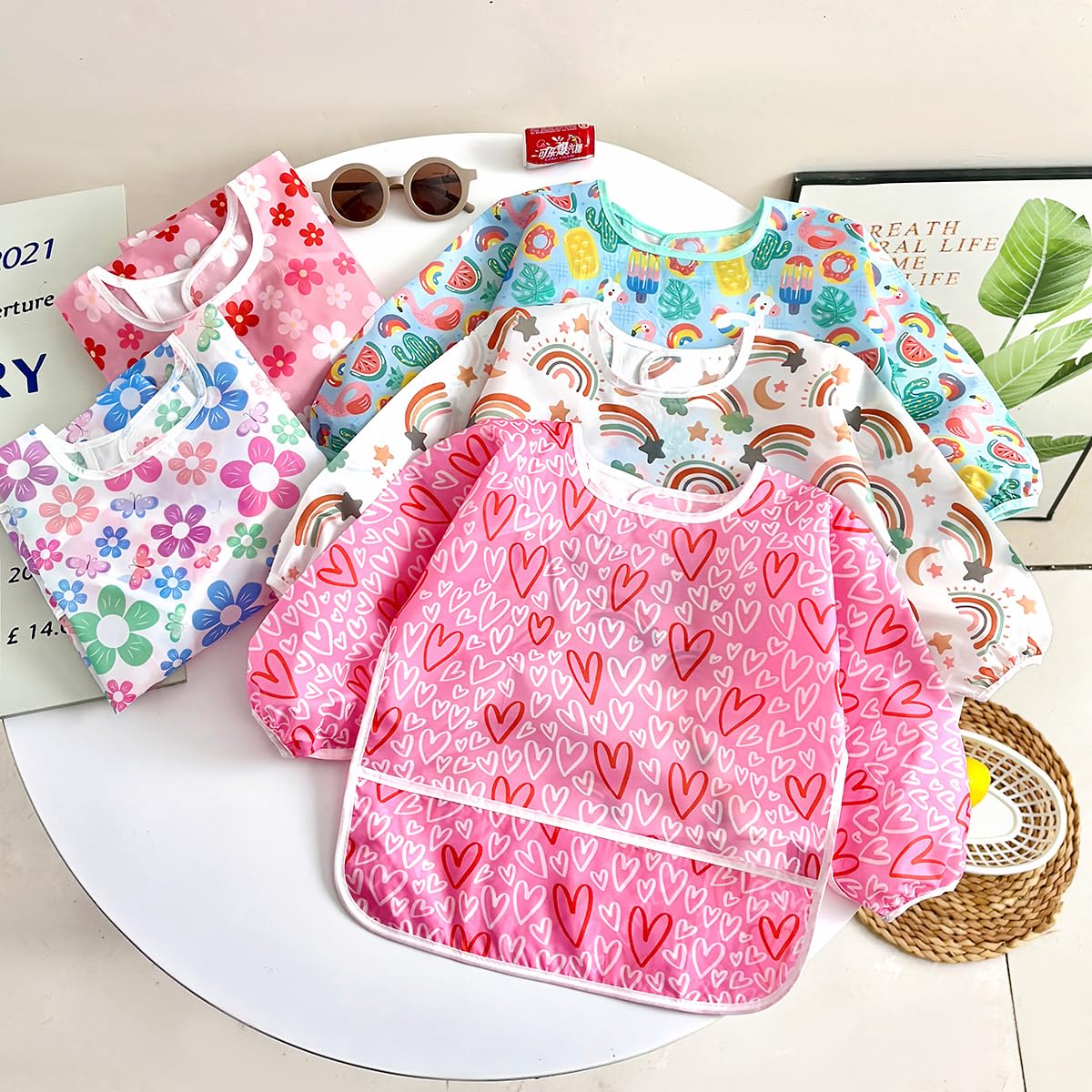 PandaEar bib back-closure shows adjustable fit for ages 6 to 36 months.