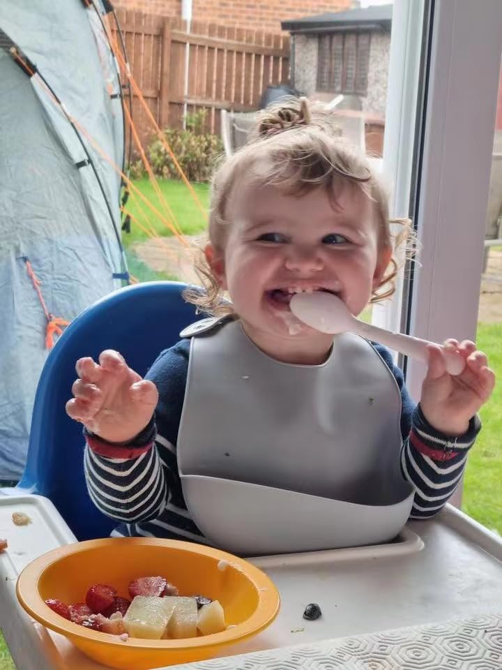 PandaEar bibs with crumb catcher pocket for catching spills during meals.