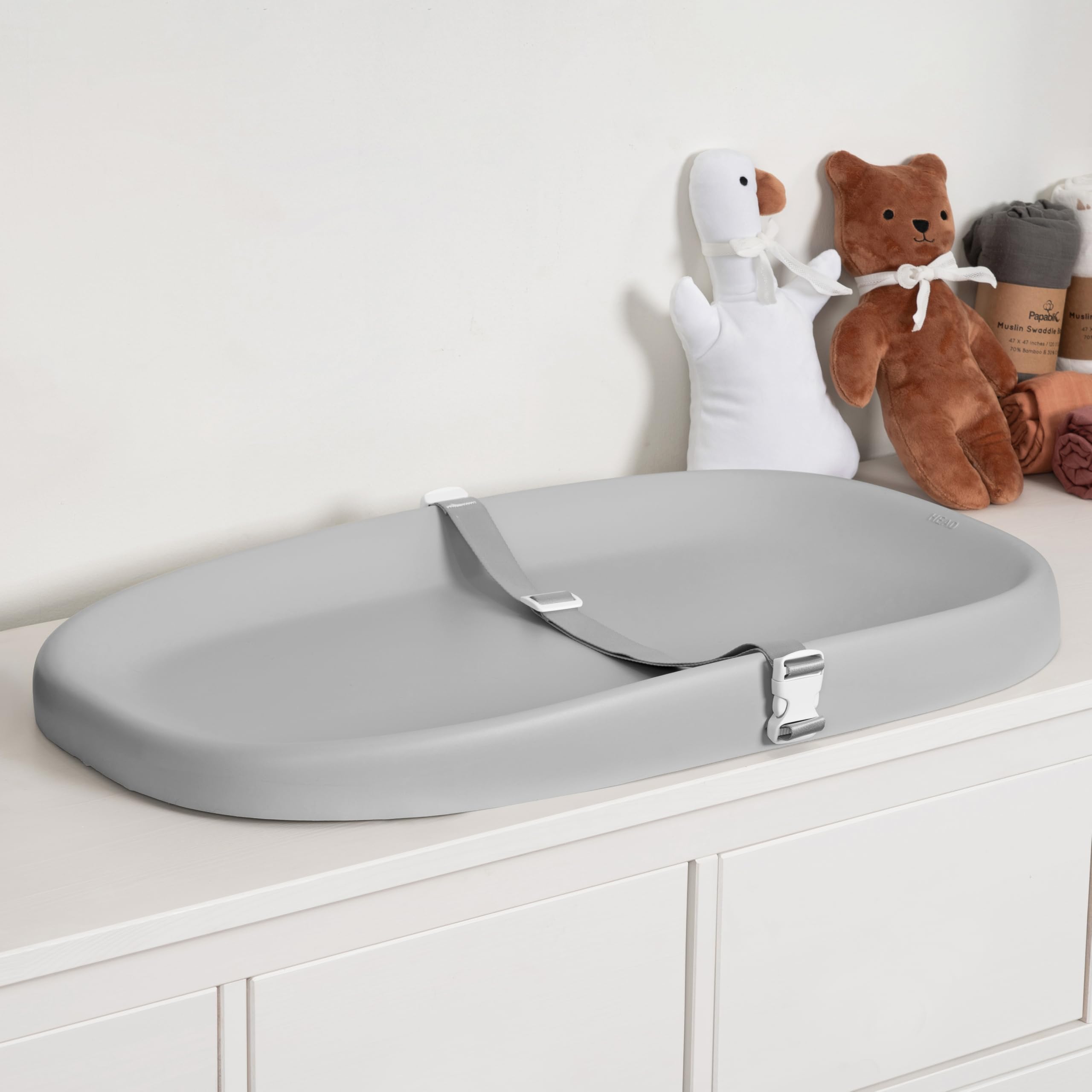 Papablic wipeable changing pad with removable safety strap for quick cleanup after diaper changes.