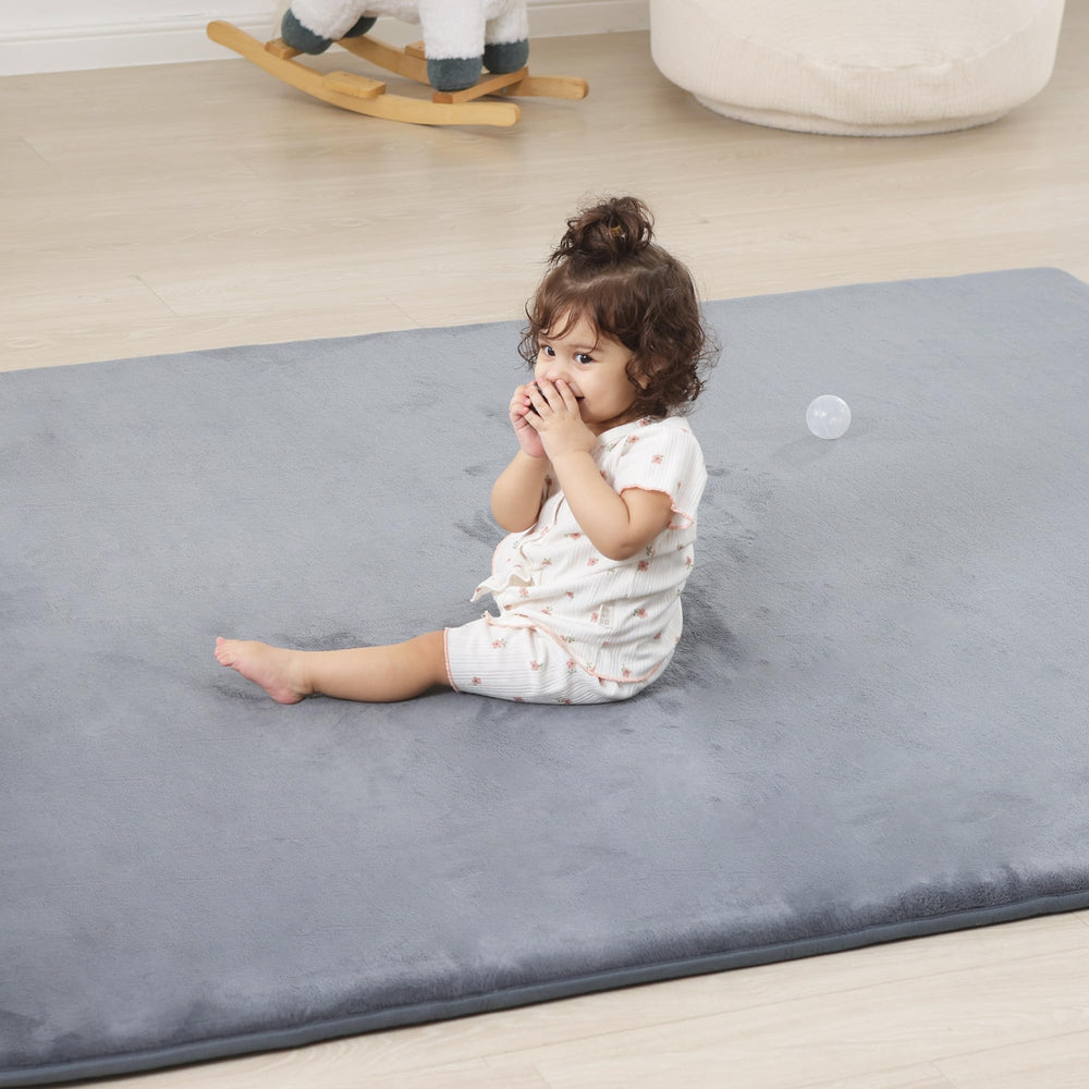 PaPaMat 1.3-inch thick baby mat cushions crawlers and tummy time on hard floors.