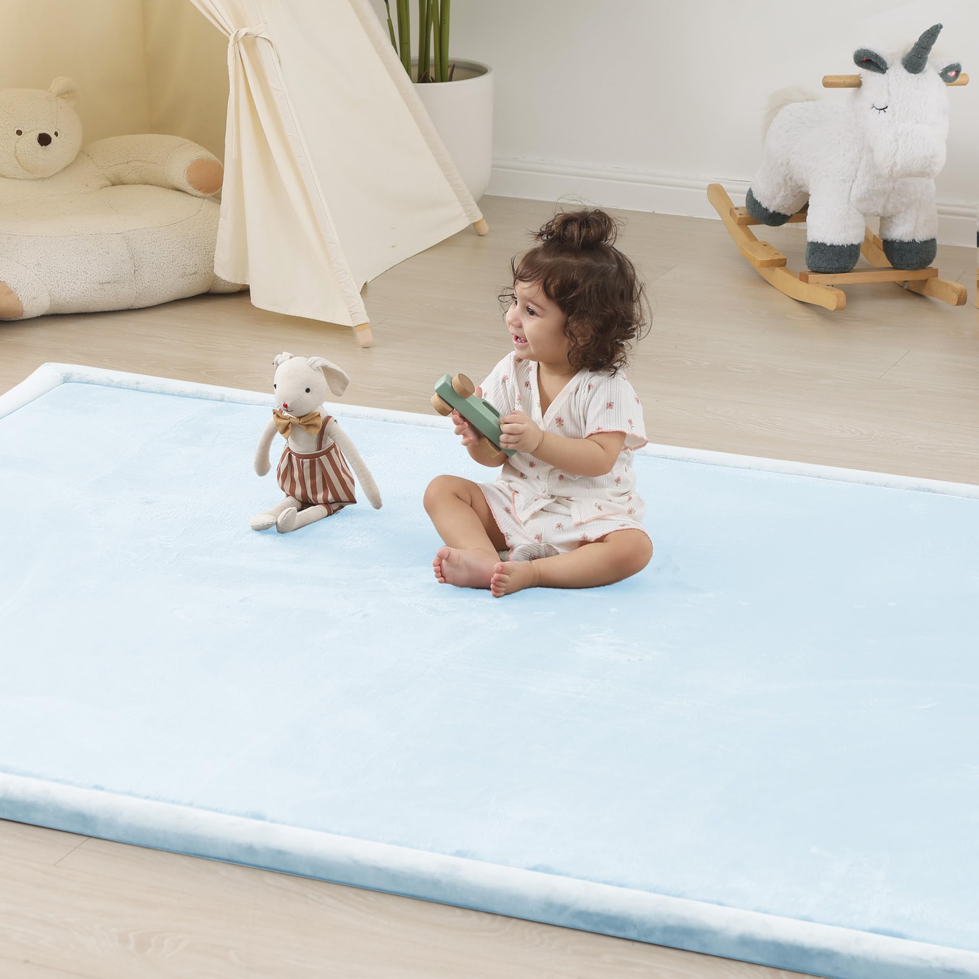 PaPaMat 1.5-inch thick blue play mat, unrolled for tummy time and exploration.