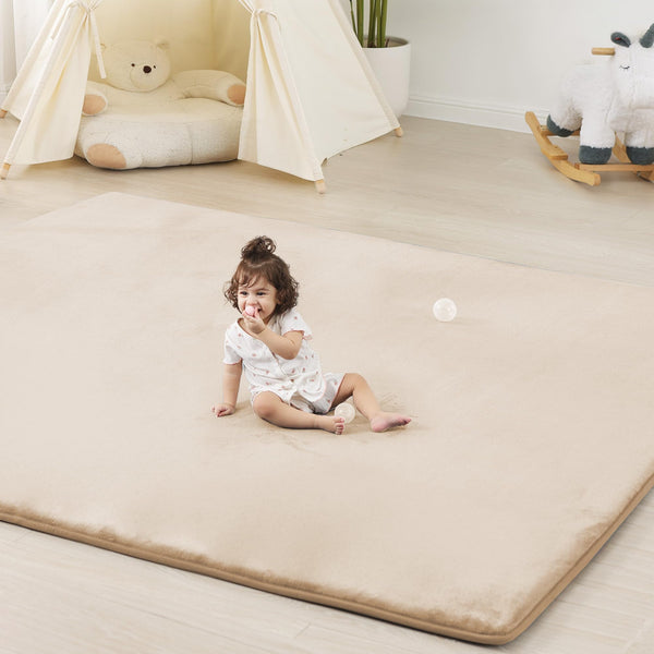 PaPaMat 13-inch thick play mat with beige color cushions babies during tummy time.