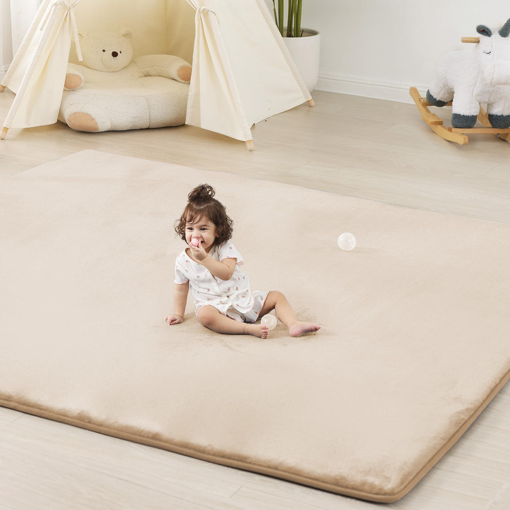 PaPaMat 13-inch thick play mat with beige color cushions babies during tummy time.