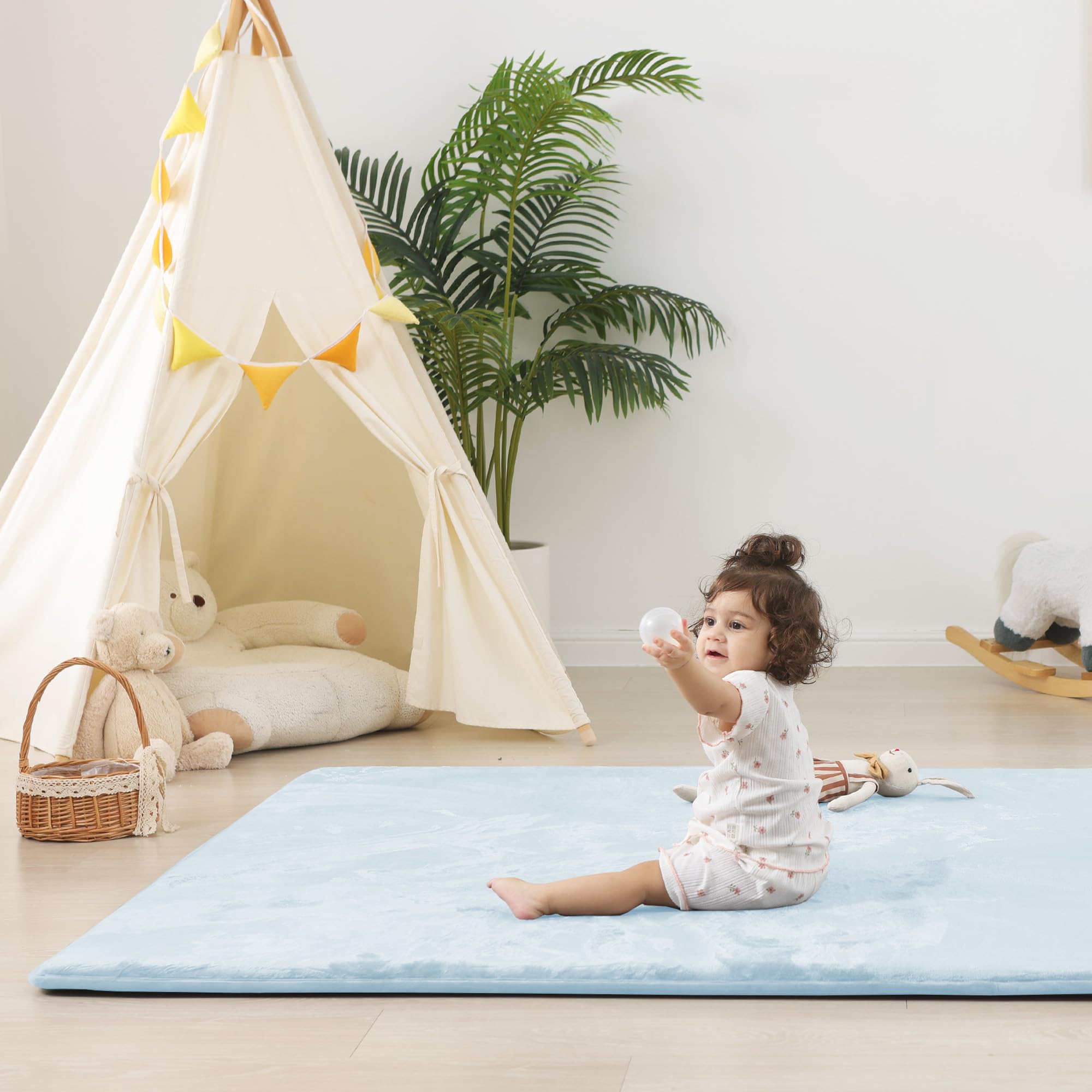 Baby crawling on PaPaMat with ample space for tummy time and exploration.