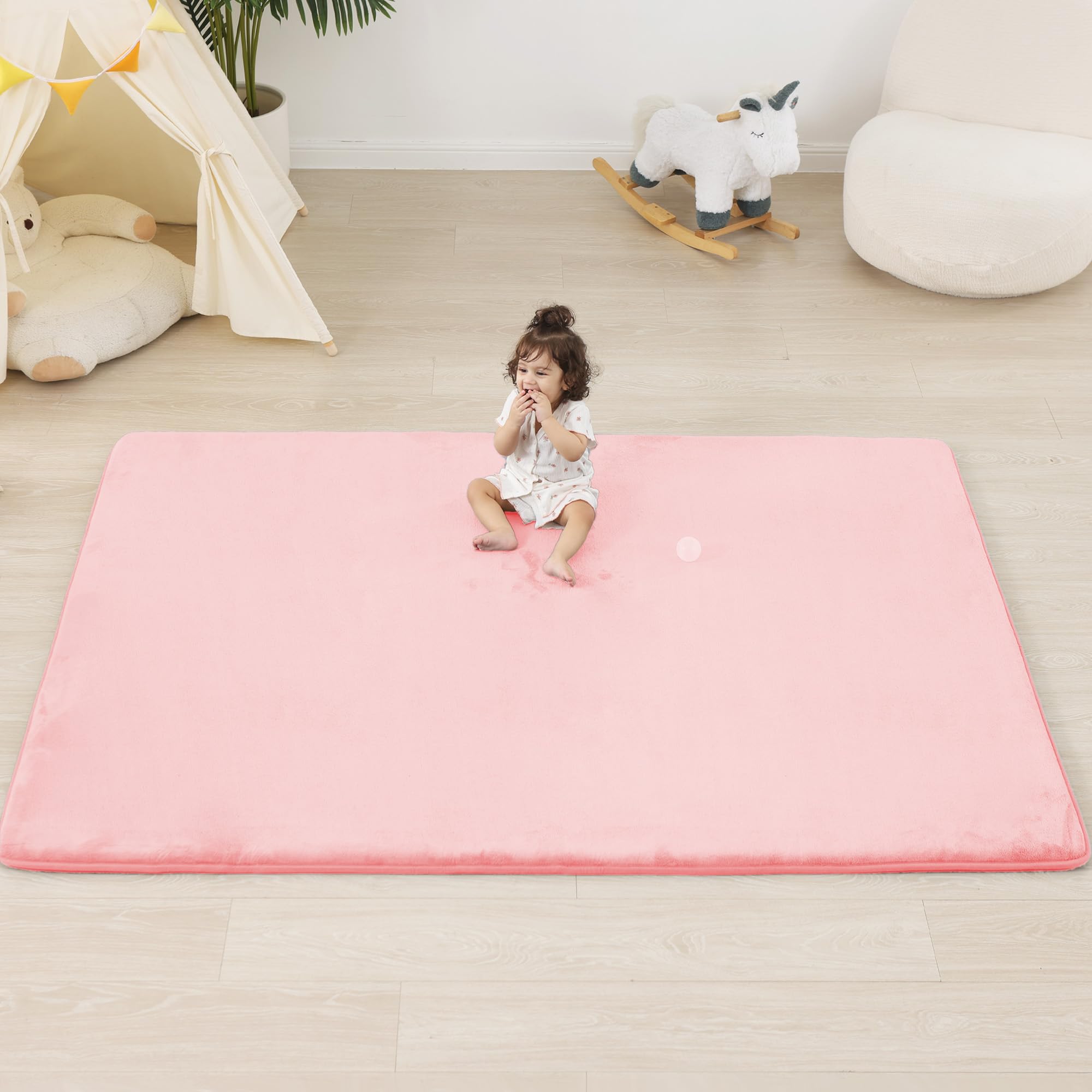 PaPaMat 1.3-inch thick cushioning provides comfy tummy time on a large pink play mat