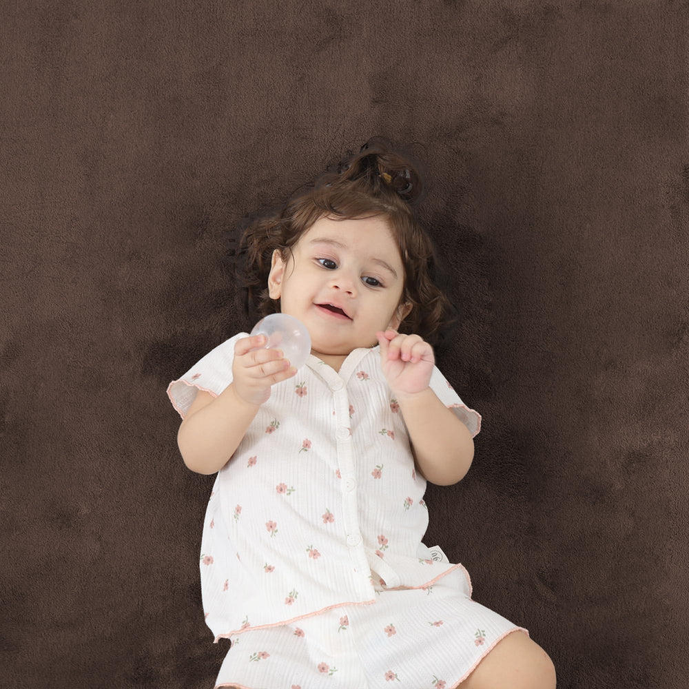 PaPaMat tummy-time mat cushions early movement and exploration.