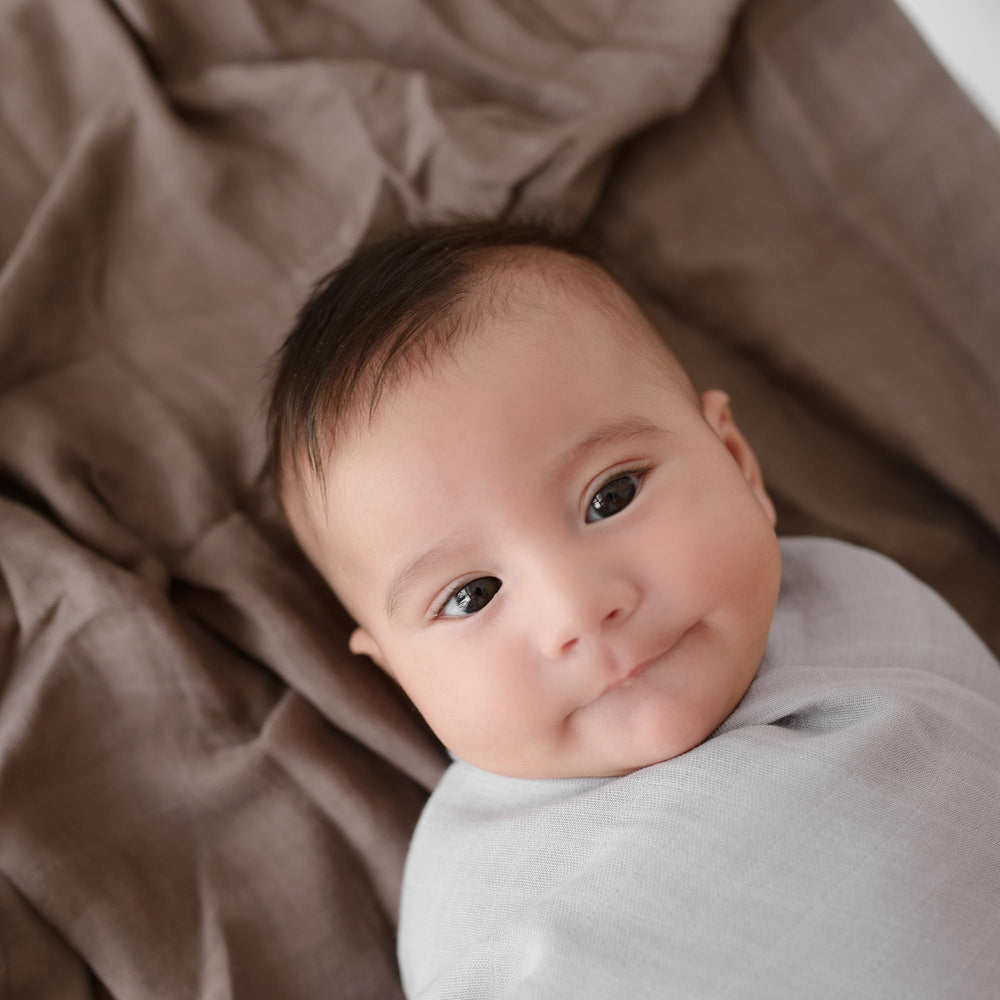 Papaya Kids easy-care tag on blanket, machine washable swaddle.