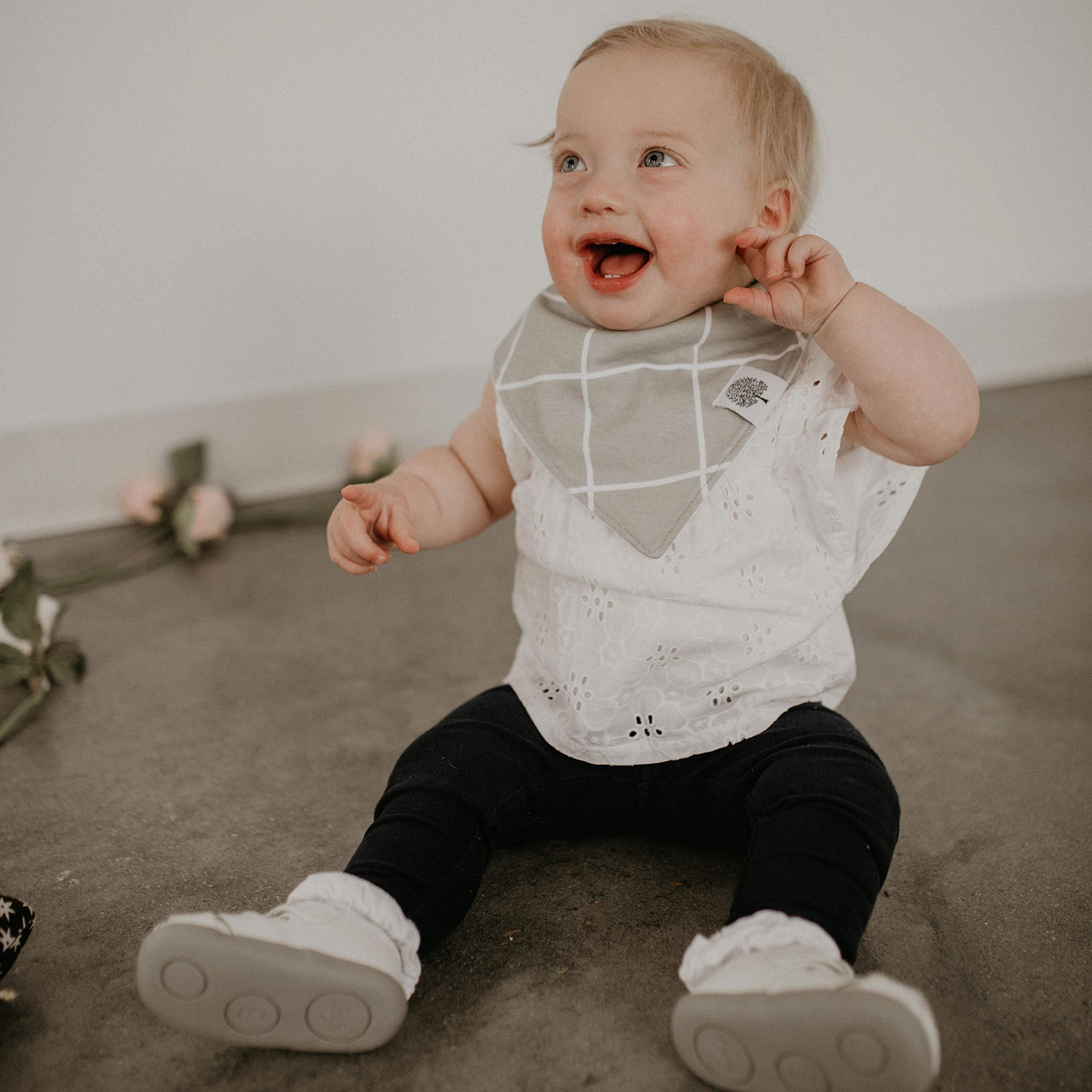 Parker Baby Co. butterfly-pattern bib protects outfits during mealtime adventures.