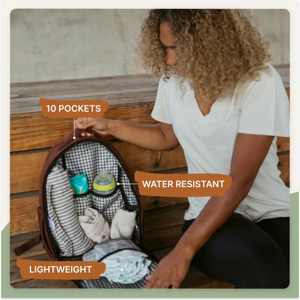 Parker Baby Co. Drift Backpack Lite on stroller handle demonstrates hands-free convenience