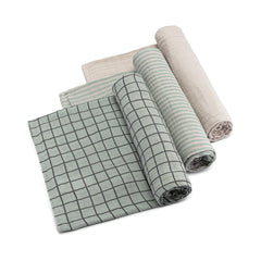 Parker Baby Co sage swaddle blanket indoors showcasing soft muslin for calming sleep