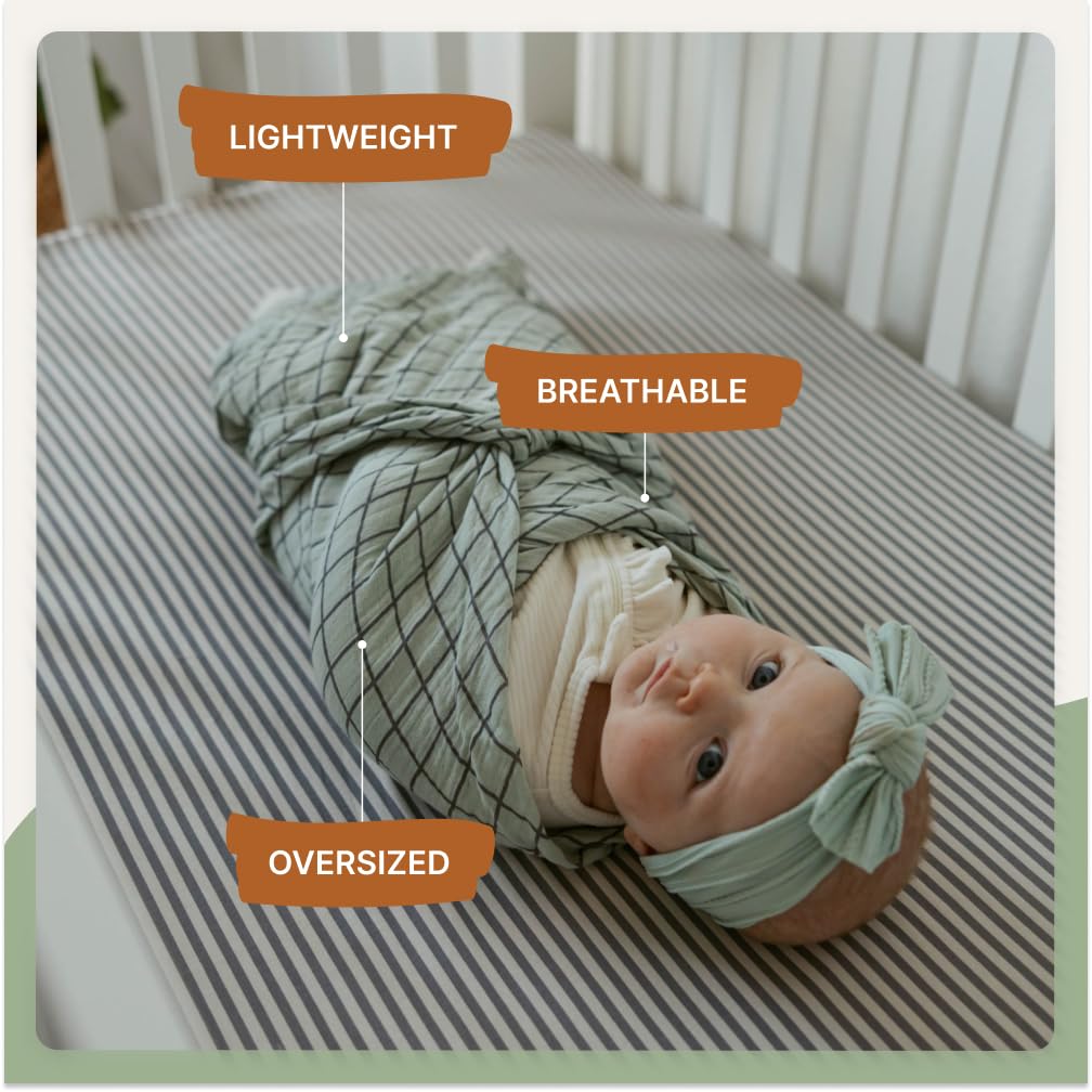 Parker Baby Co sage swaddle shown as stroller cover during a sunny outing