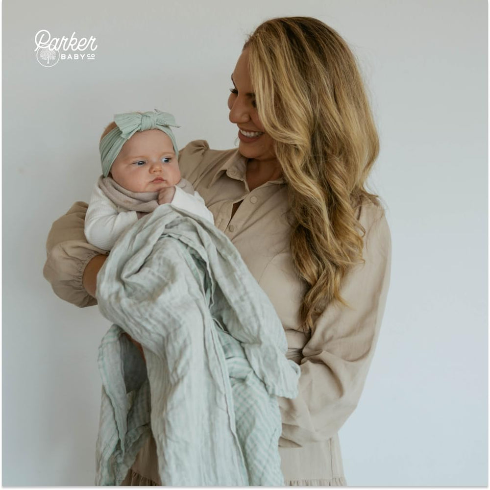 Parker Baby Co sage muslin blanket used as tummy time mat