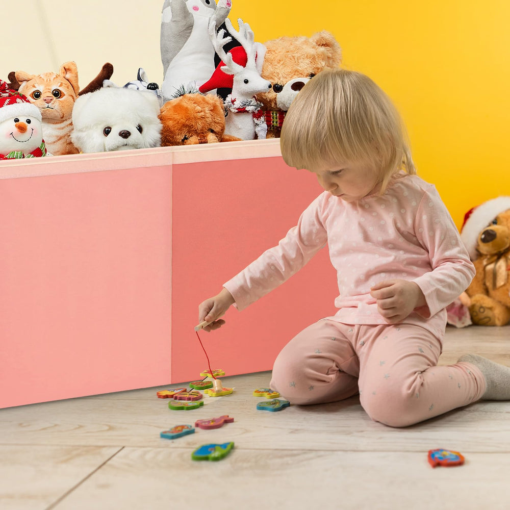 Patelai pink toy box protects belongings while hiding clutter.