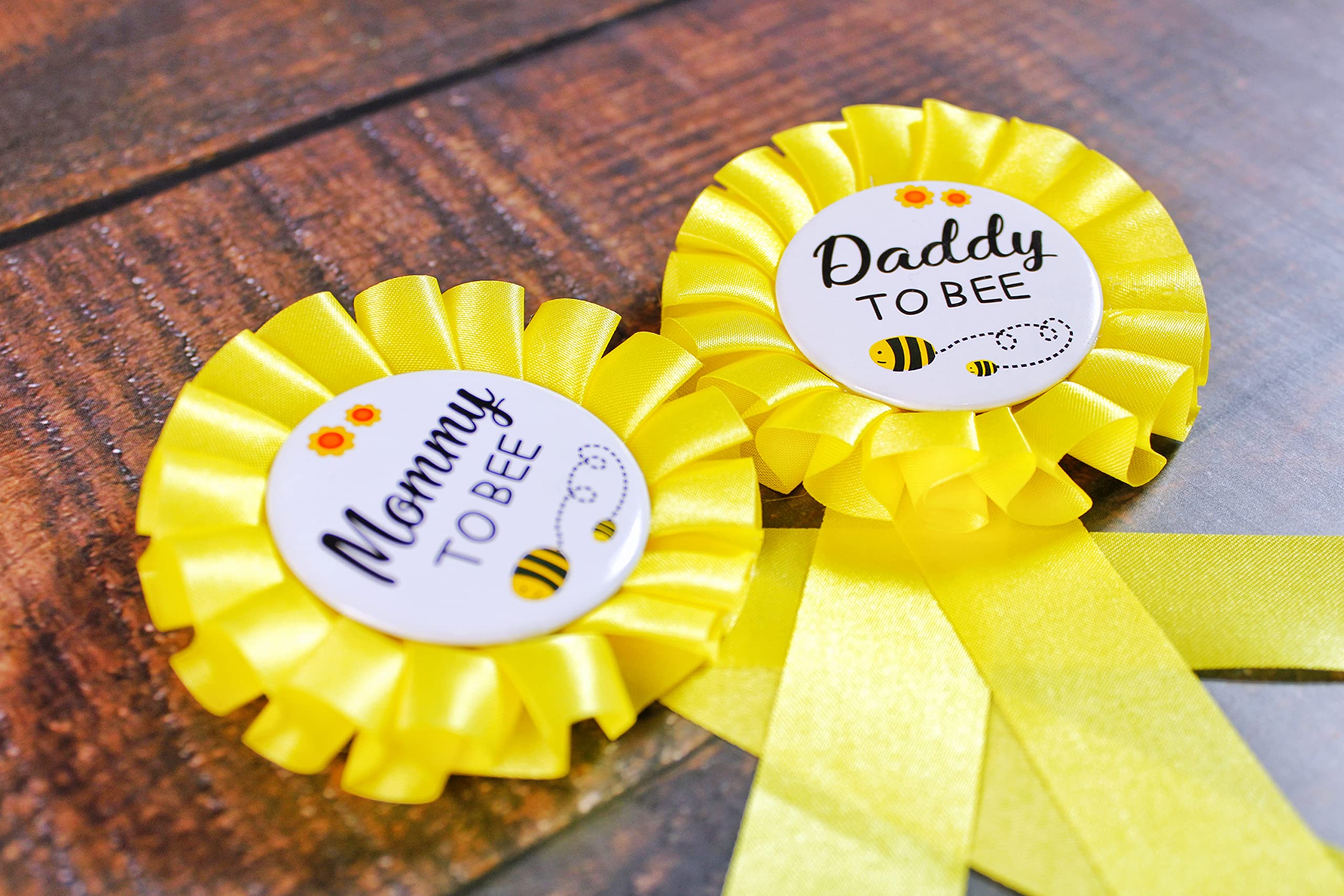 PATICARRY daddy to be tinplate badge on outfit during celebrations.