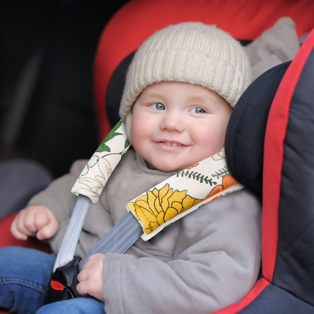 Pea Pod floral stroller strap cover adds comfort on walks