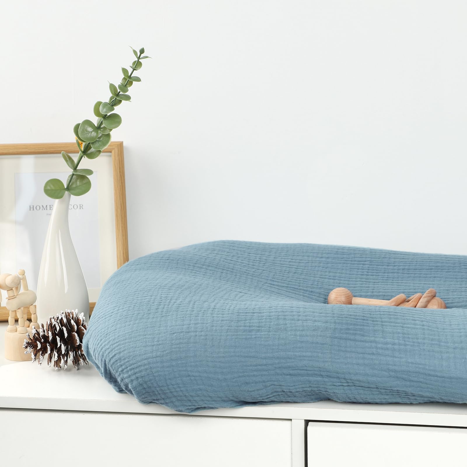 Pea Pod breathable infant lounger cover supports calm rests.