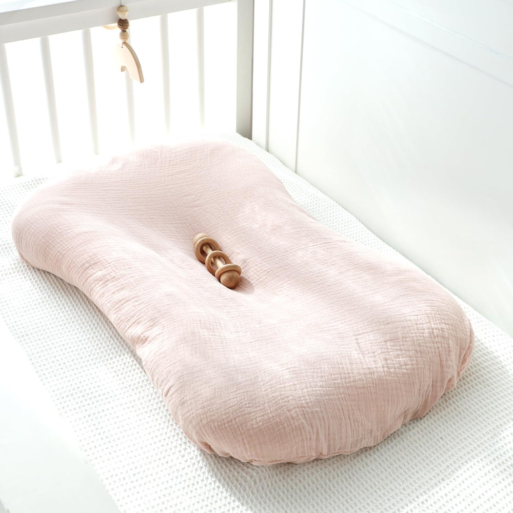 Pink color adds gentle style to infant nest and nap time.