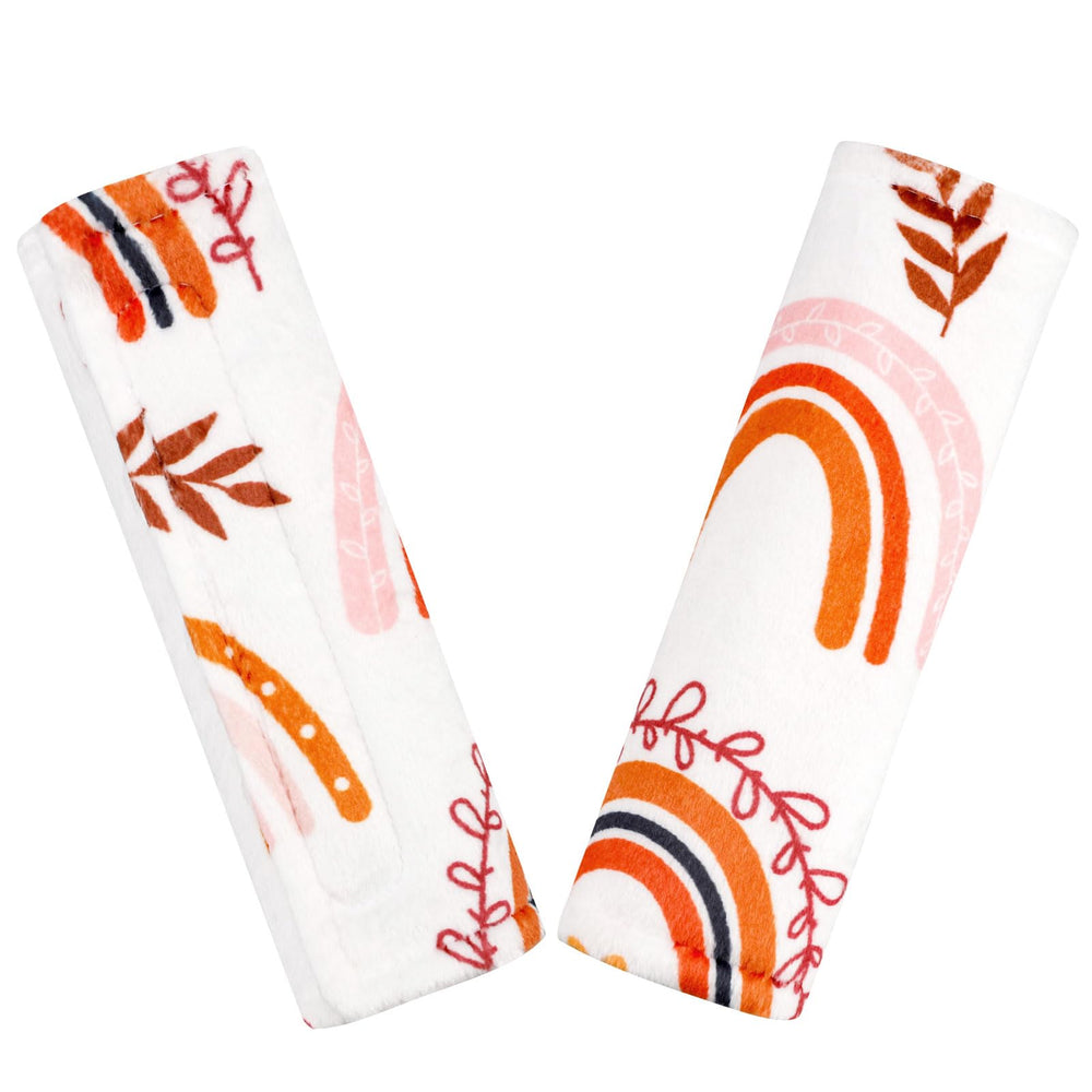 Pea Pod rainbow strap cover on car seat shows soft, skin-friendly comfort.