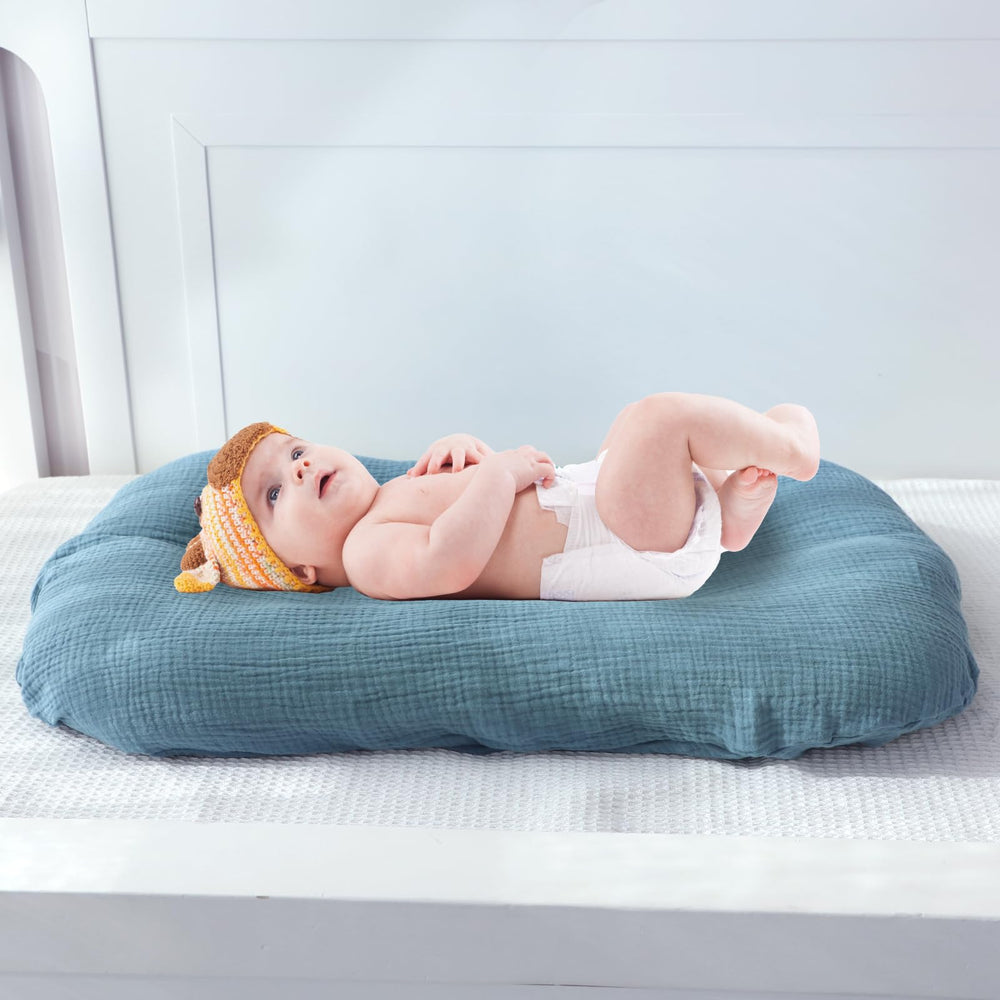 Pea Pod stylish blue nursery cover adds practical charm.