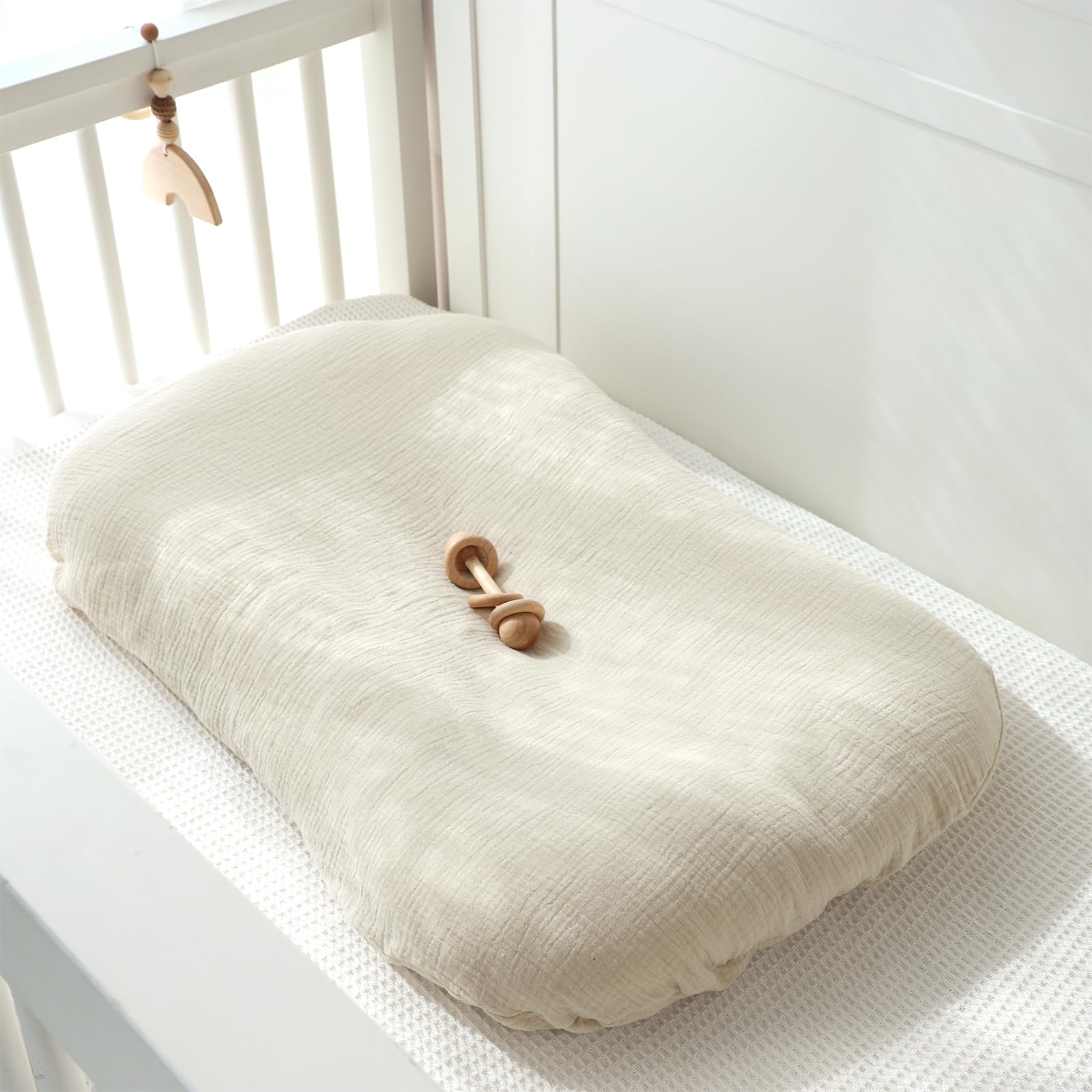 Pea Pod apricot cover adds modern style to infant nesting spaces