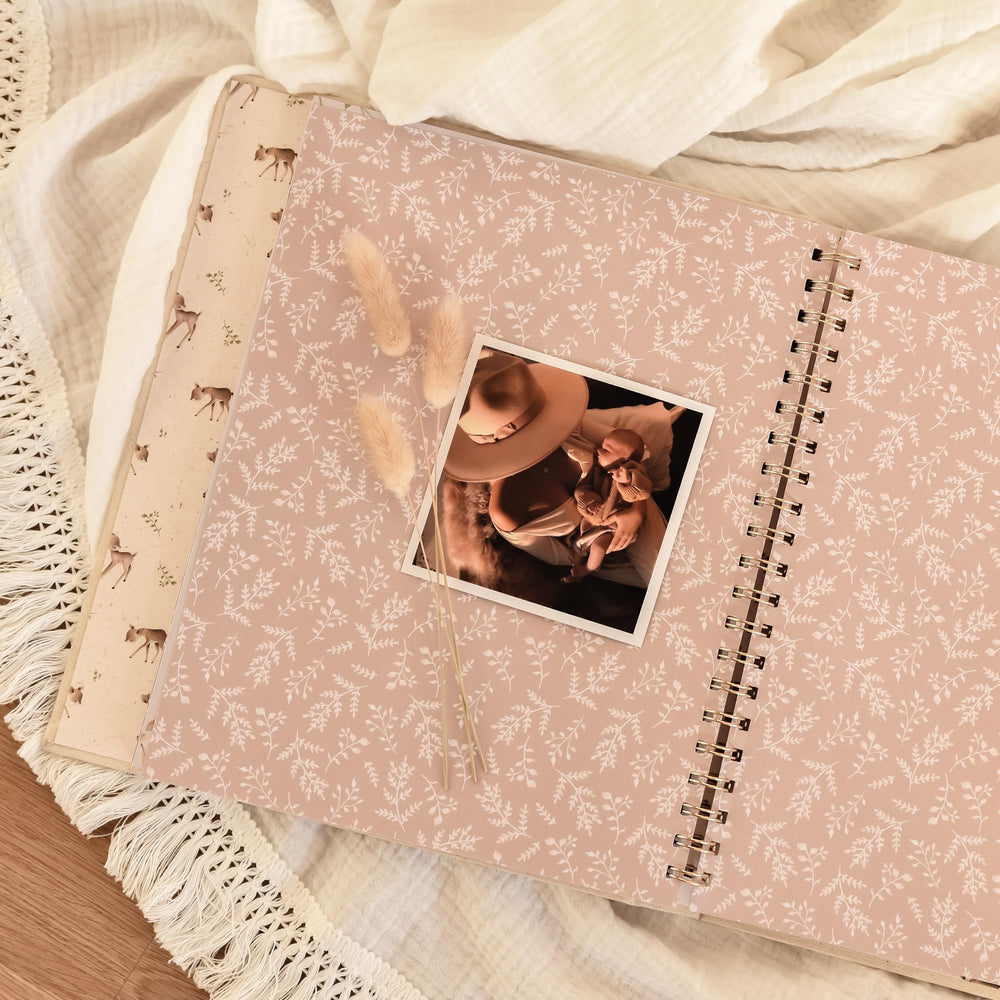 Removable dividers help organize keepsakes and notes in Peachly memory book.