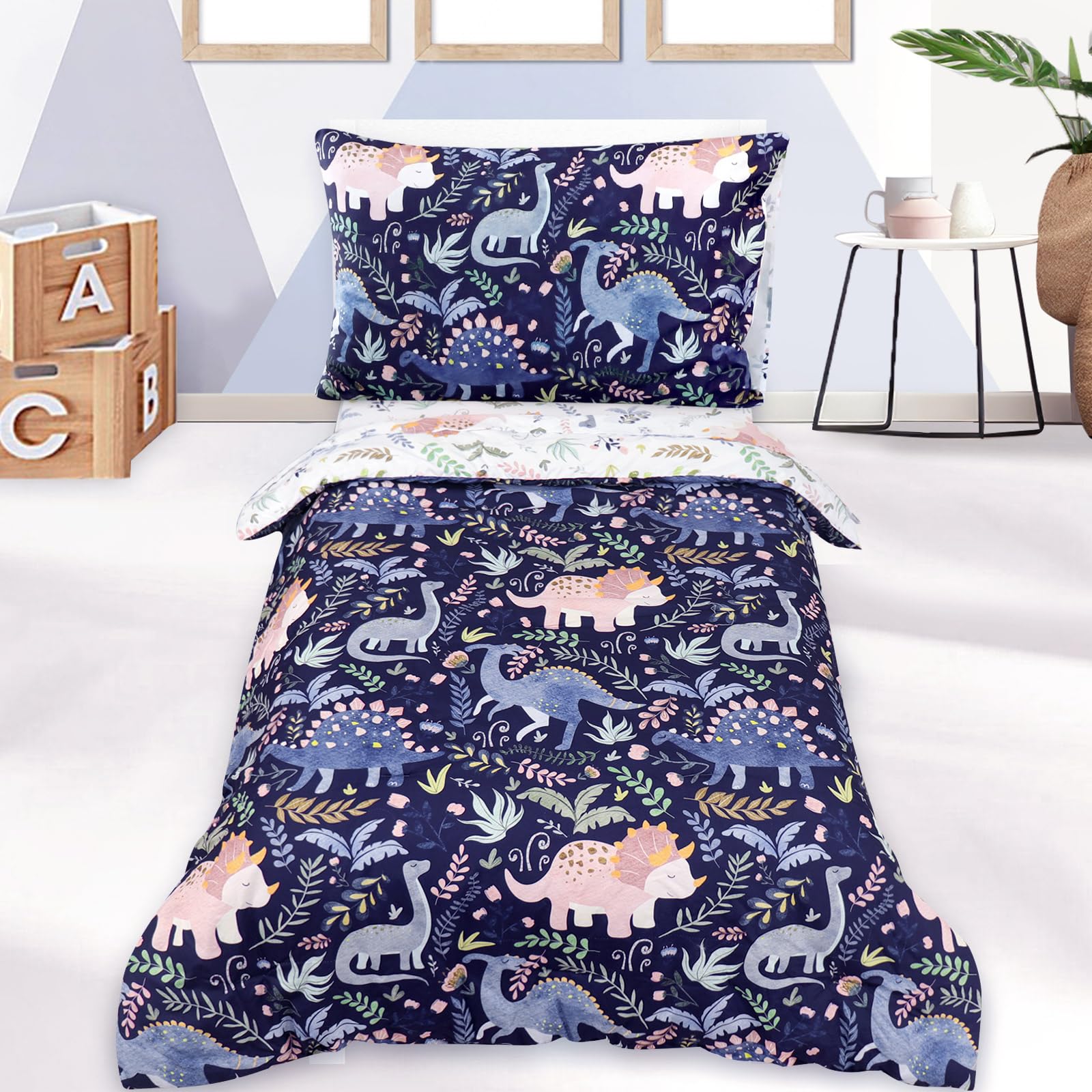 Pea Pod dinosaur bedding comforter in blue adds playful style to toddler bed