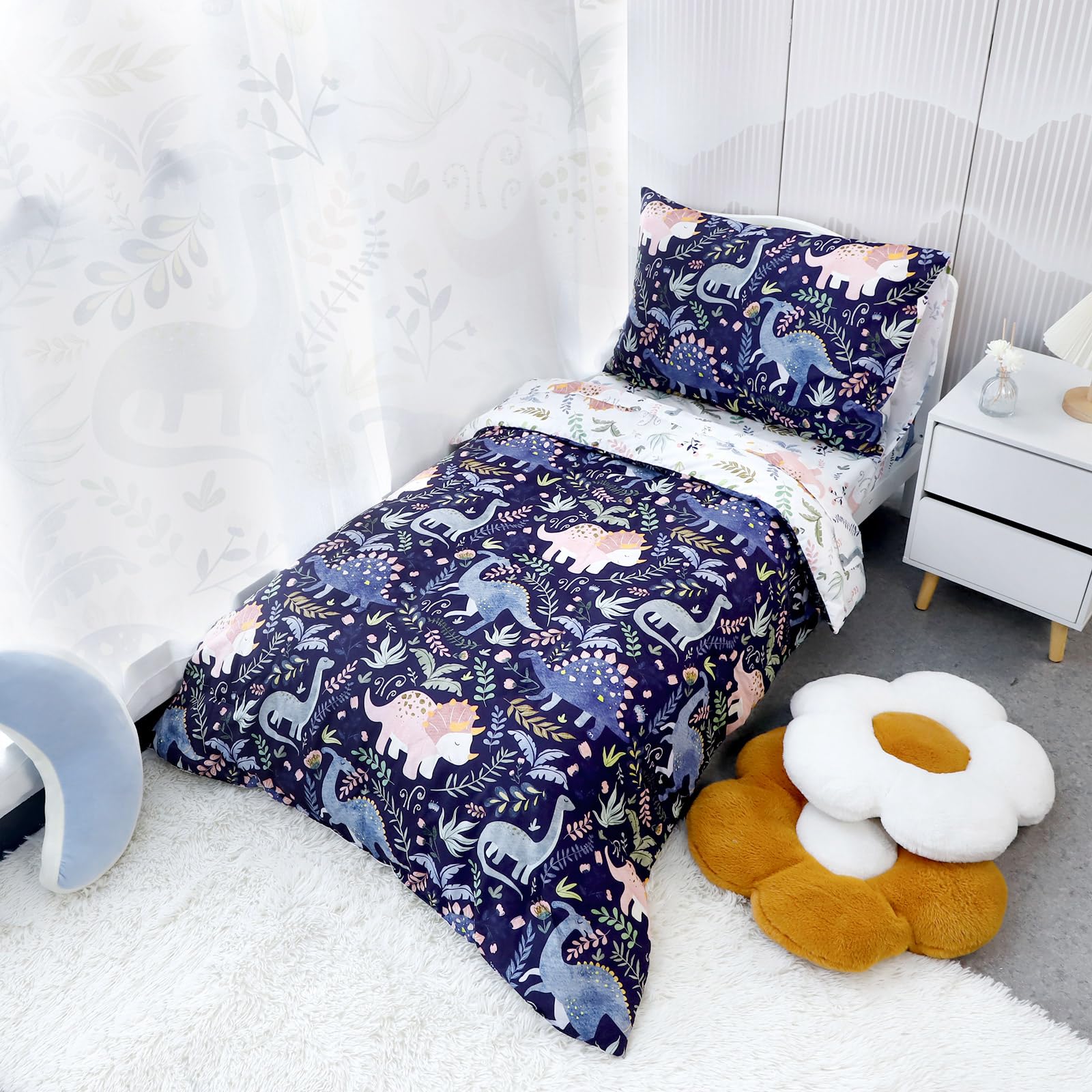 Pea Pod dinosaur pattern flat sheet in blue showcases bold detailing for cozy sleep