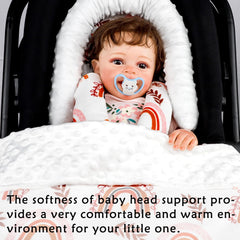 Pea Pod head support placed in car seat offering extra-long full-body comfort.