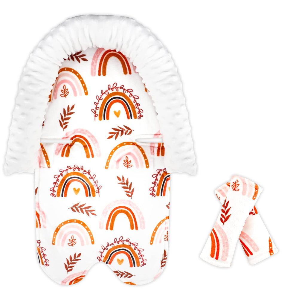 Pea Pod Rainbow head support in carseat for newborn comfort and secure harness fit.